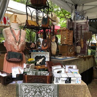 Artisan accessories: beaded and statement necklaces, bone and stone earrings, hand sewn leather bags of different sizes, hat bands, boot belts