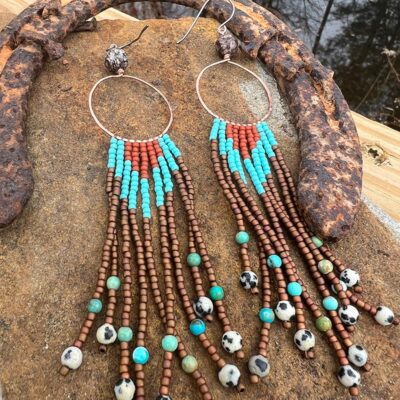 Jewelry from various materials and elements including copper, silver, gold, brass, stones, crystals, leather, feathers, shells and bones.